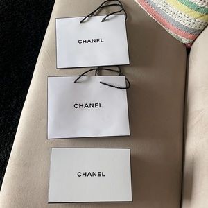 Bundle of 2 Chanel paper shopping bags, box and pouch